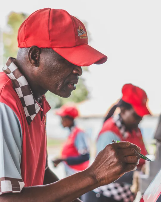 A staff member serving customers