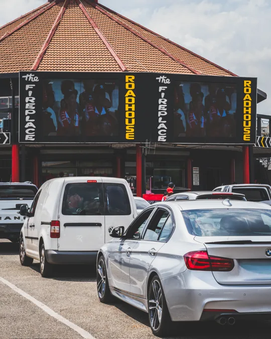 Cars parked outside the roadhouse building