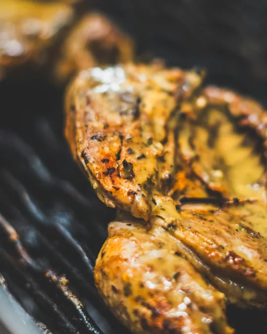 Grilled chicken cooking on the grill