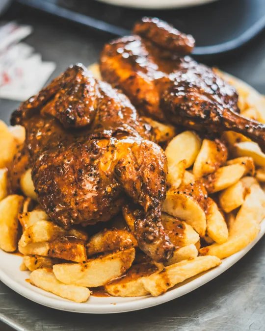 Grilled chicken and chips on a plate
