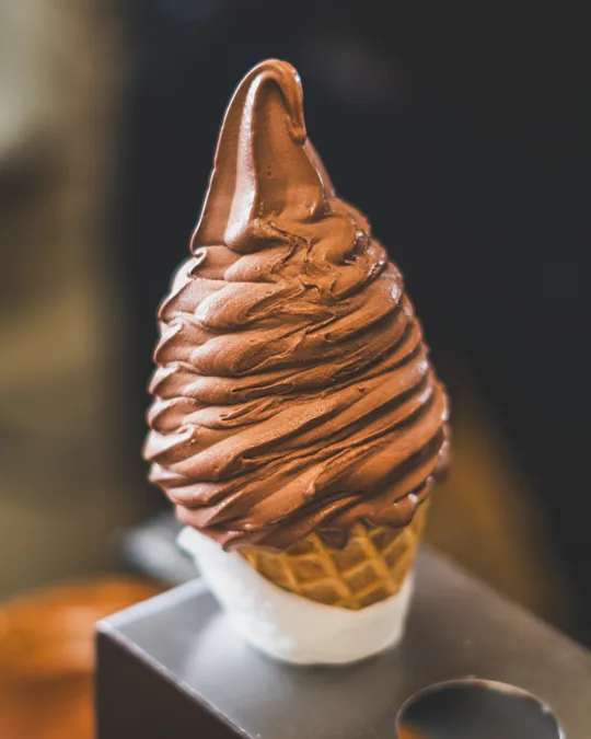 Chocolate-dipped soft-serve ice cream cone